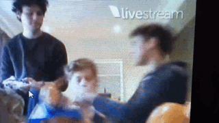 Cake with Michael. Luke’s reaction though, for a few seconds he looks genuinely scared! (gif