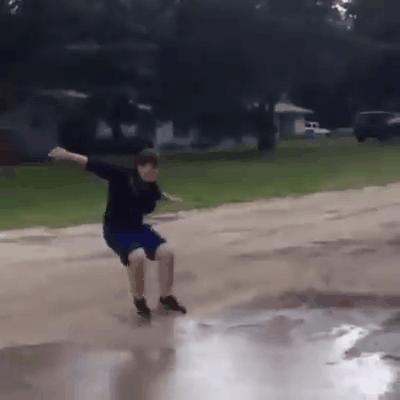 He jumps over a puddle