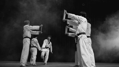 Jackie Chan breaks four pieces of Wood fighting sports gif fighting gifs jackie chan gifs four kicks at once teaching technique