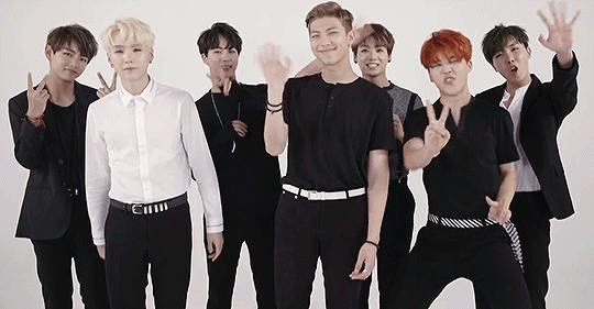 Let's see what we have here...a suprisingly normal acting V,swaggin suga, aegyoing jin, awkwardly waving and face crumping RapMon, cute Kookie, a retarded Power Ranger who lost his way ans accidently landed amongst bts, and finally JHope proudly showing the cameraman that his hand has got 5 fingers...yes these are the men ruling/ruining my life