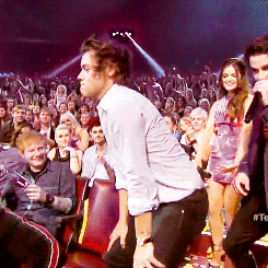 Most people will watch this gif and see Harry Styles twerking, possibly even Ed Sheeran laughing behind him, but I, all I see is R5 in the back!