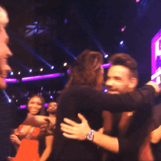 The boys celebrating with a group hug after winning the AMA Artist of the Year award - 11/22/15