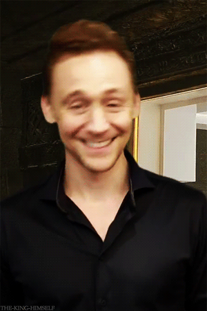 Tom is adorable!!! XD *gif* and I can tell what the backdrop is its the prison from Thor 2