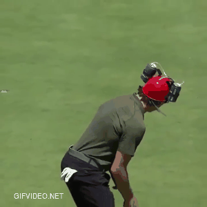 Very good golfing. he has a beer helmet.