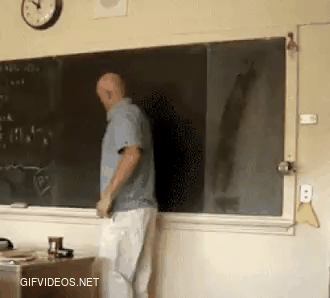 A teacher draws a perfect circle on a chalkboard