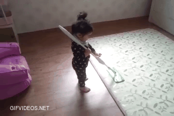 Cute toddler likes the mop