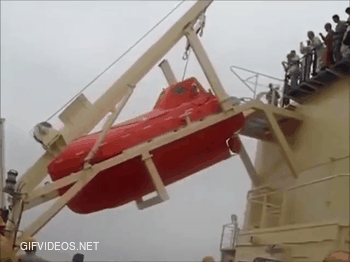 Lifeboat with passengers makes a perfect flip