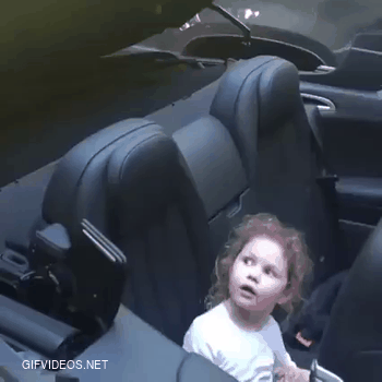 Little girl isn't too sure with what's going on.